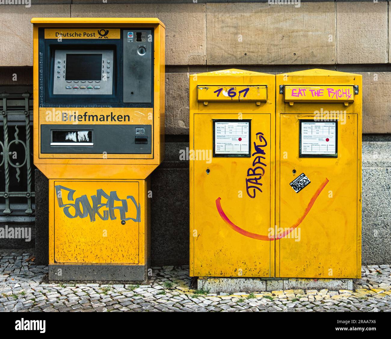 Yellow mail box and Stamp machine outside Potsdam Main Post Office, Am Kanal 16-18, Potsdam, Brandenburg, Germany Stock Photo