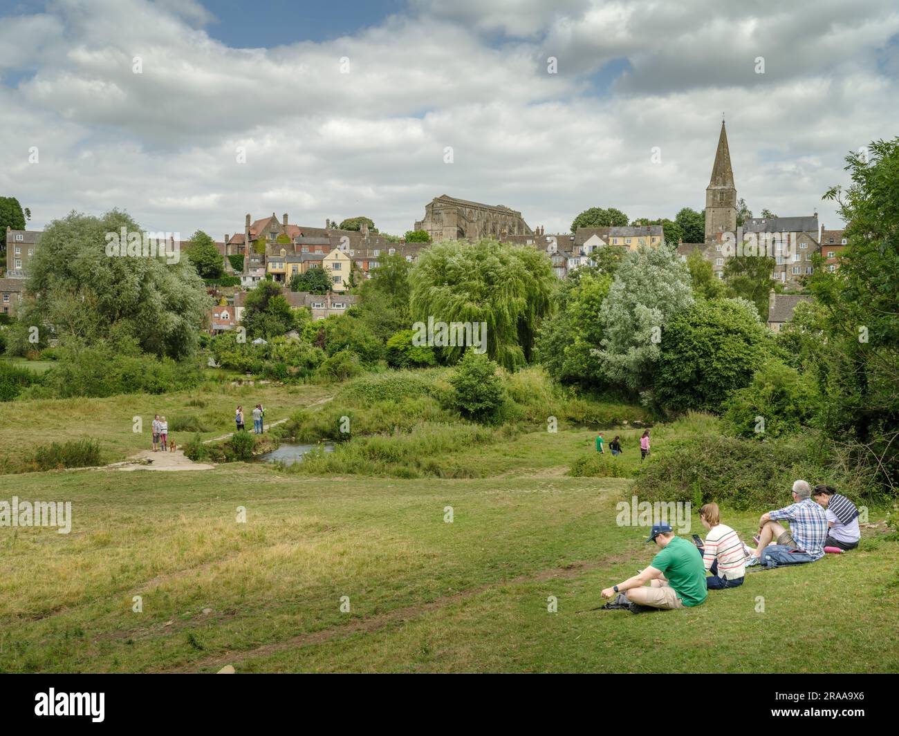 Sunday 2nd July 2023. Malmesbury, Wiltshire, England - On a warm summers day, people enjoy the sunshine and a gentle breeze on the river walk at the picturesque Wiltshire market town of Malmesbury. Credit: Terry Mathews/Alamy Live News Stock Photo