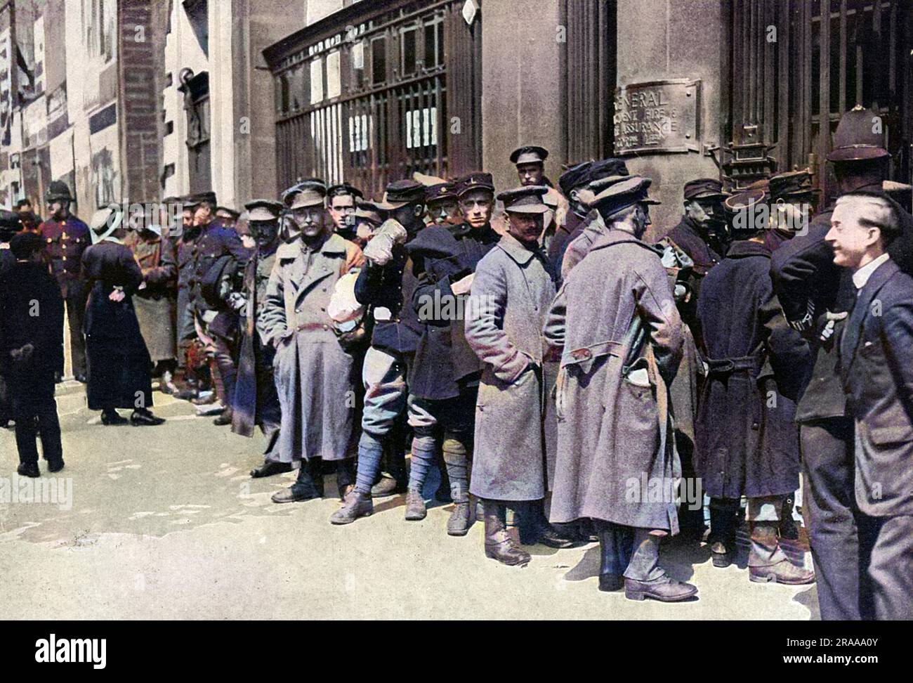 Belgian Army troops, on leave in London, wait at Aldwych for railway passes to visit their refugee families.  As many men who were granted leave from the front had relatives in England, Belgian soldiers were a familiar sight in London during the First World War.     Date: 1915 Stock Photo