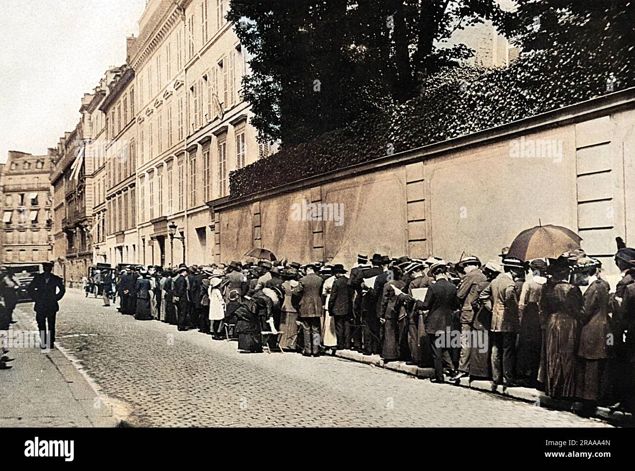 Many British people were enjoying their summer holidays abroad when the war began and as the crisis became more acute, there was an eager rush for home. The British Embassy in Paris was besieged by people requiring passports and whilst many travellers made it home safely, other found themselves detained as prisoners in Germany.     Date: 1914 Stock Photo