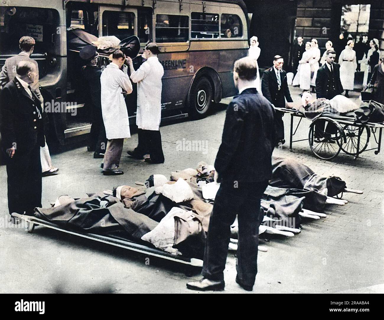 Evacuating hospital patients from a London hospital at the beginning of World War Two. For the evacuation of patients to the country, motor coaches were temporarily converted into motor ambulances.     Date: 1939 Stock Photo