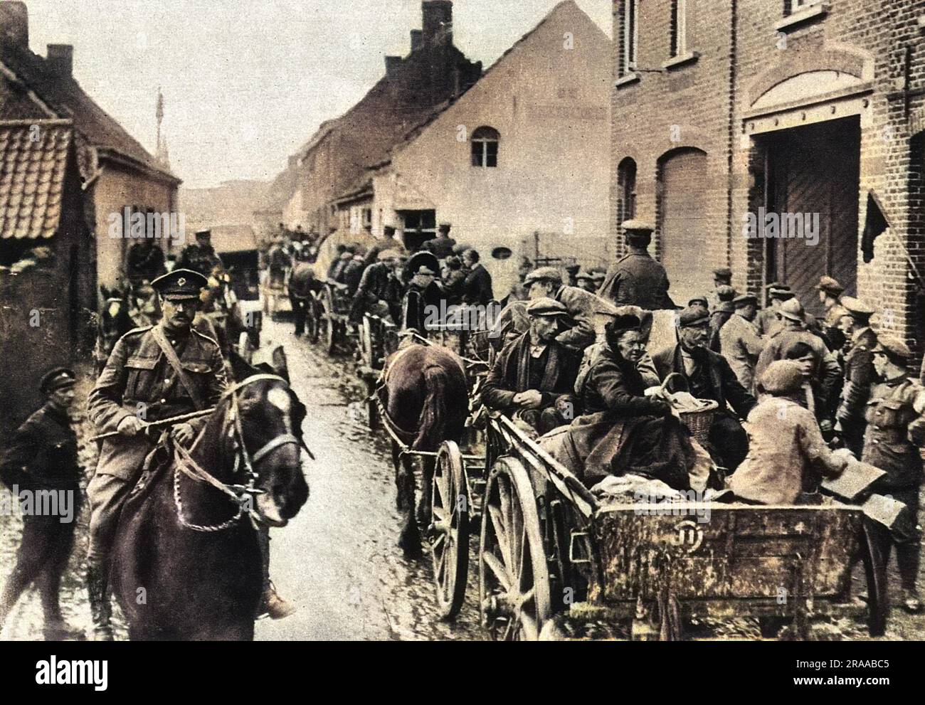 Liberation: the freeing of the civil population. Rescued after living for four years in the enemy lines: a party of French refugees being conveyed to safety in Northern France after cessation of hostilites in World War One.     Date: Nov-18 Stock Photo