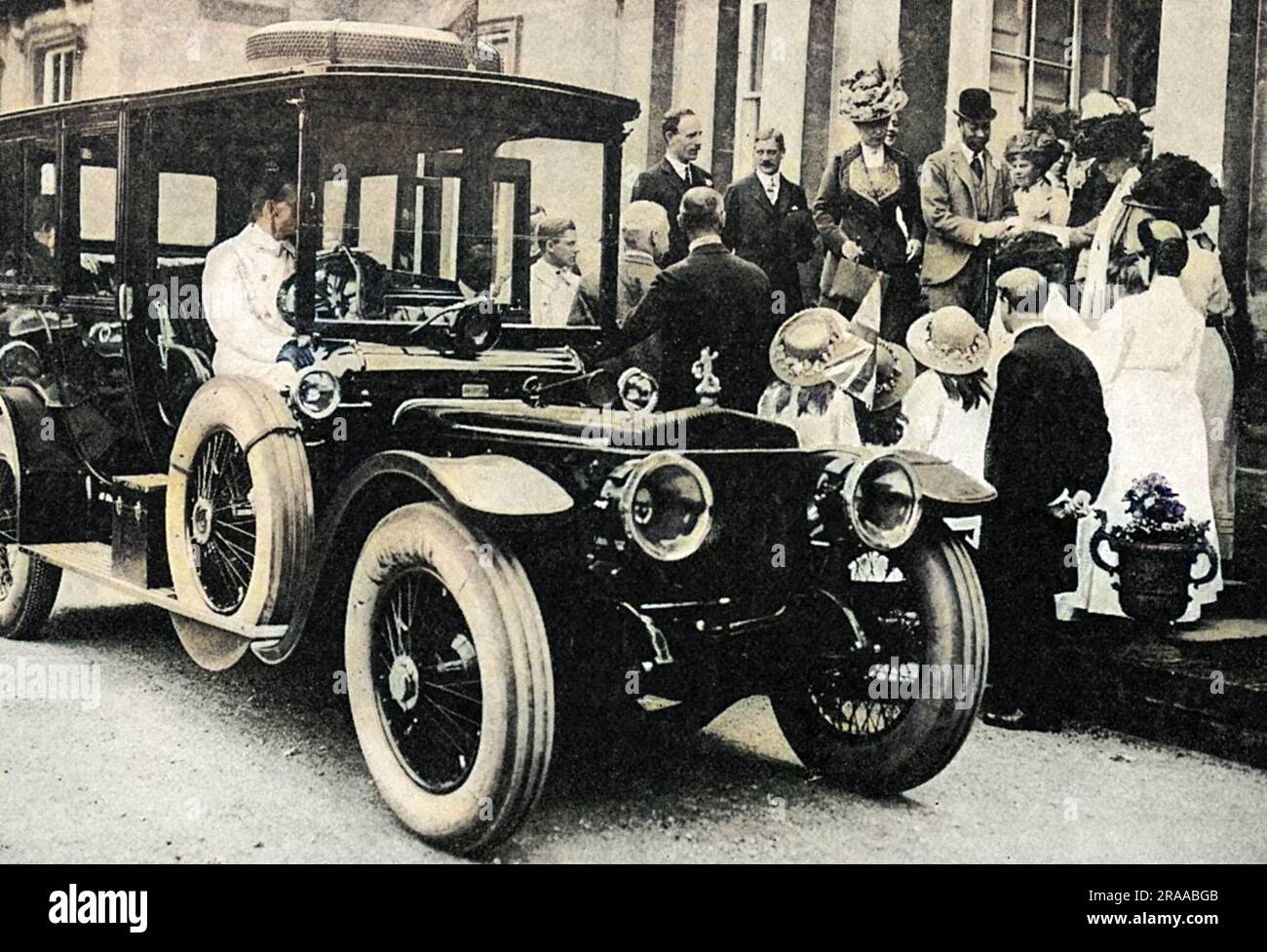 King George V and Queen Mary about to enter their Daimler car during a visit to Yorkshire in July 1912.     Date: 1912 Stock Photo