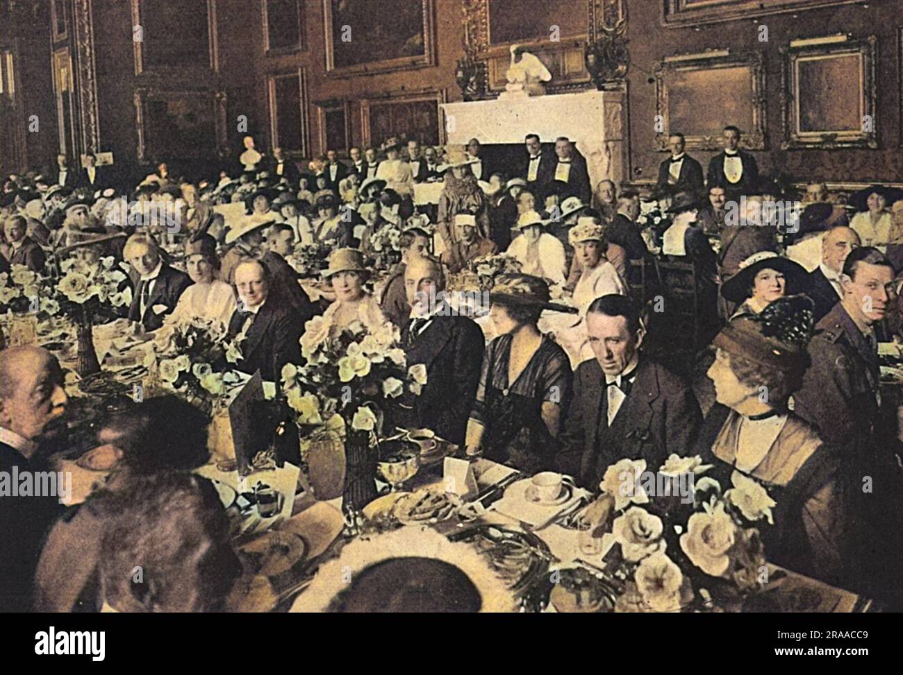 The Souvenir Luncheon at Grosvenor House in aid of the Three Arts War Fund, which was followed by a garden fete.  The Duke of Westminster lent his house for the occasion which was attended by Queen Alexandra and a great deal of society.  Photograph shows a view of one of the luncheon rooms and the table of Lady Paget.  Amongst the well-known people are Mr Winston Churchill, who is sitting alongside Lady Paget and Mrs (Hazel) Lavery and Mr Gerald de Maurier on the right of Mrs Astor.     Date: 1916 Stock Photo