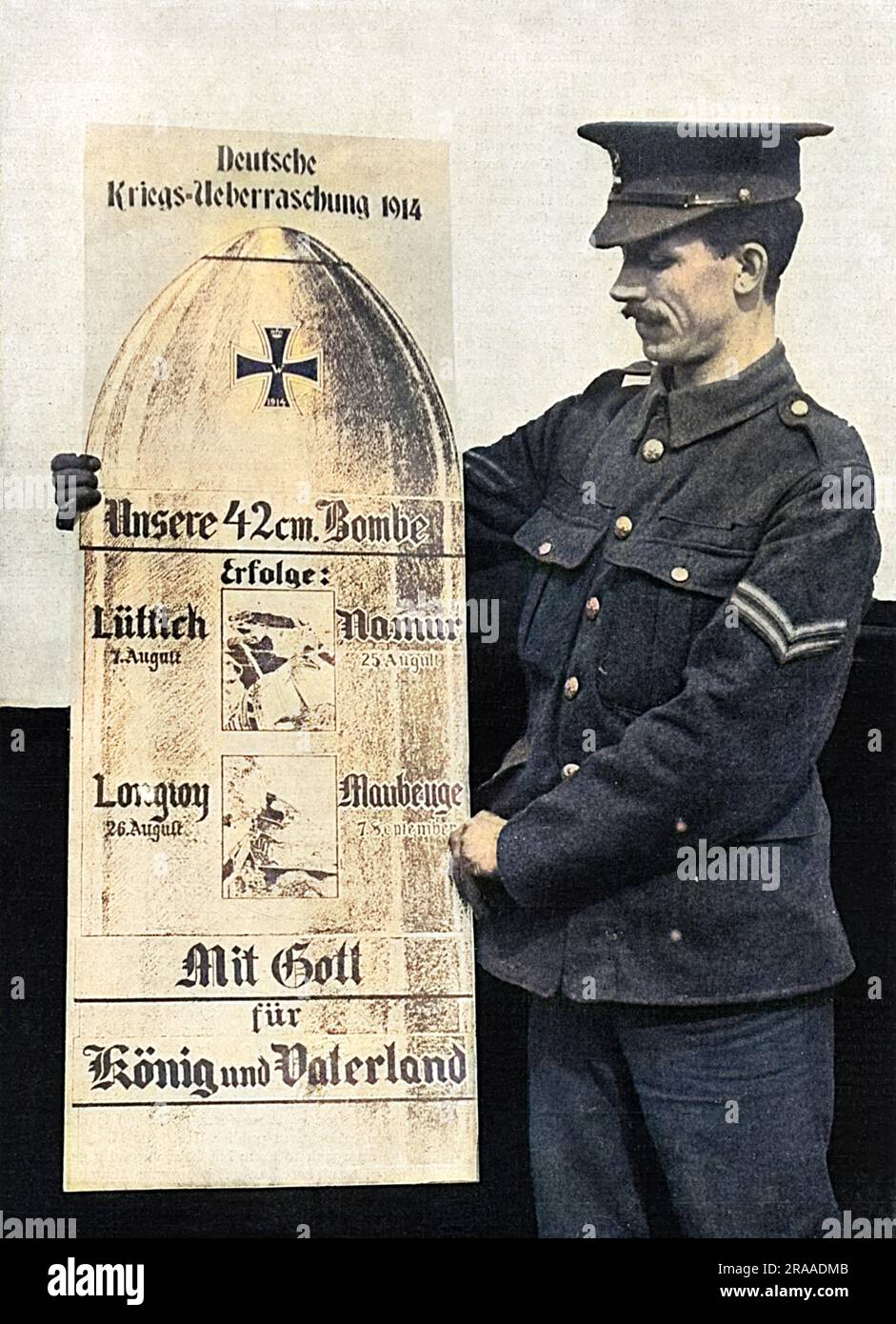 A British soldier holding a life-size replica card of a German shell, as thrown by big siege guns, complete with photographs of places in which the shells had inflicted particular damage - Liege, Namur, Longwy and Maubeuge.  The card bears the motto, 'With God for King and Fatherland,' and was available for the cost of 1d. in the Berlin streets according to The Sketch magazine.     Date: 1914 Stock Photo