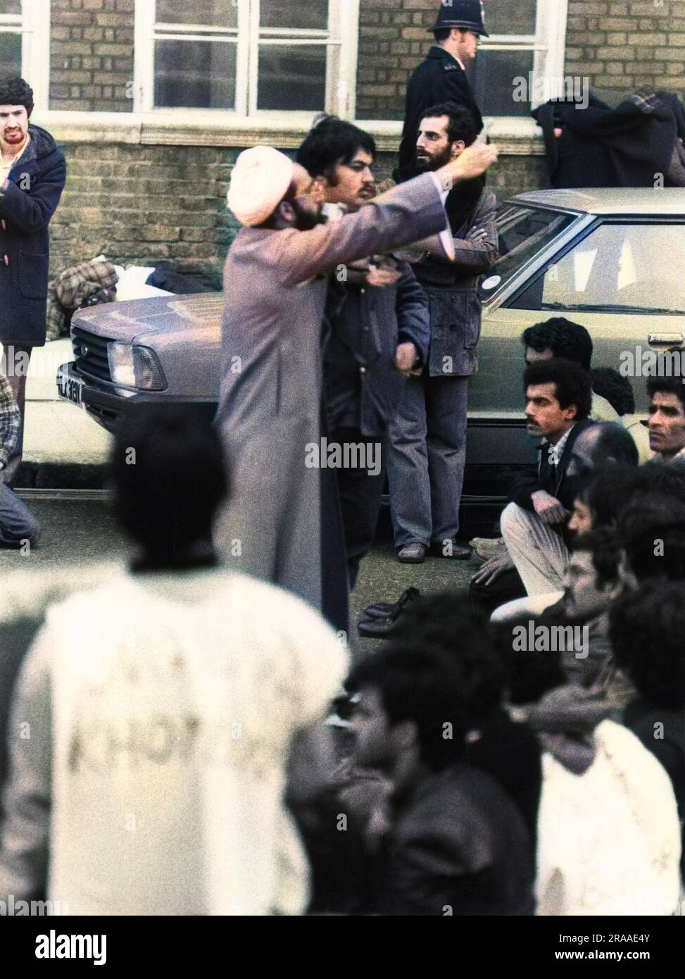 An Iranian Imam taking prayers outside during the siege of the Iranian Embassy, London.     Date: 30 April - 5 May 1980 Stock Photo
