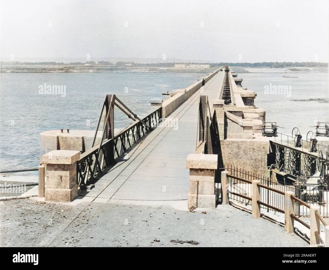 Roadway and swing bridge over lock on the Assiut or Asyut Barrage on the River Nile in Egypt, about 350 miles downstream from the Aswan Dam.     Date: 1902 Stock Photo