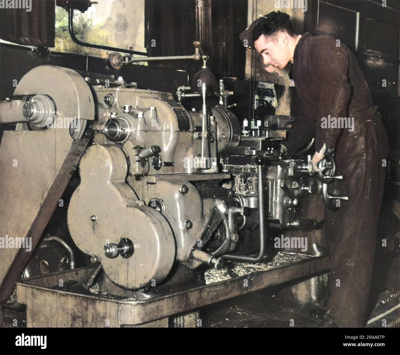 A man working on a lathe in an RAF aircraft workshop during World War II Stock Photo