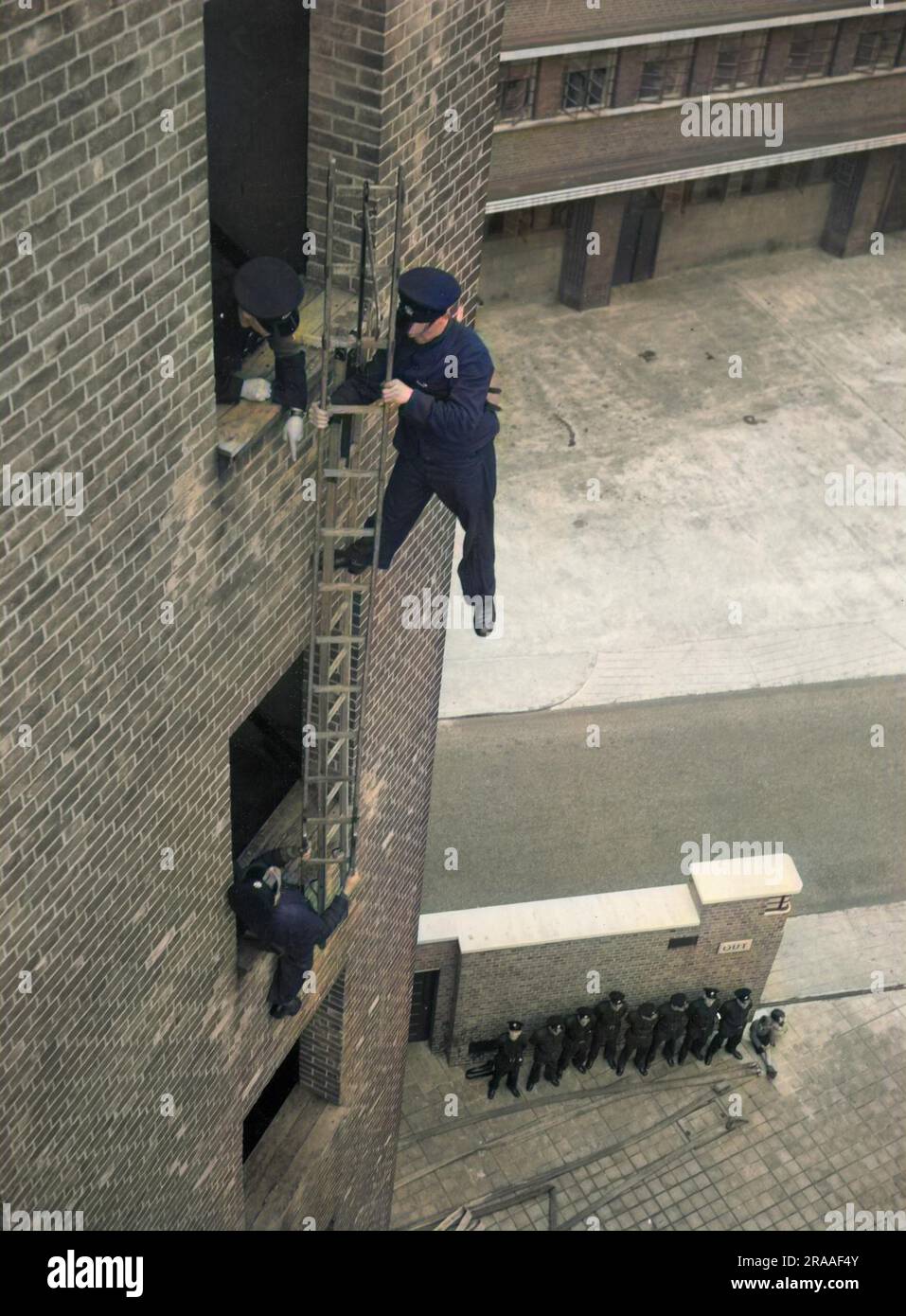Firefighter during hook ladder practice Stock Photo Alamy