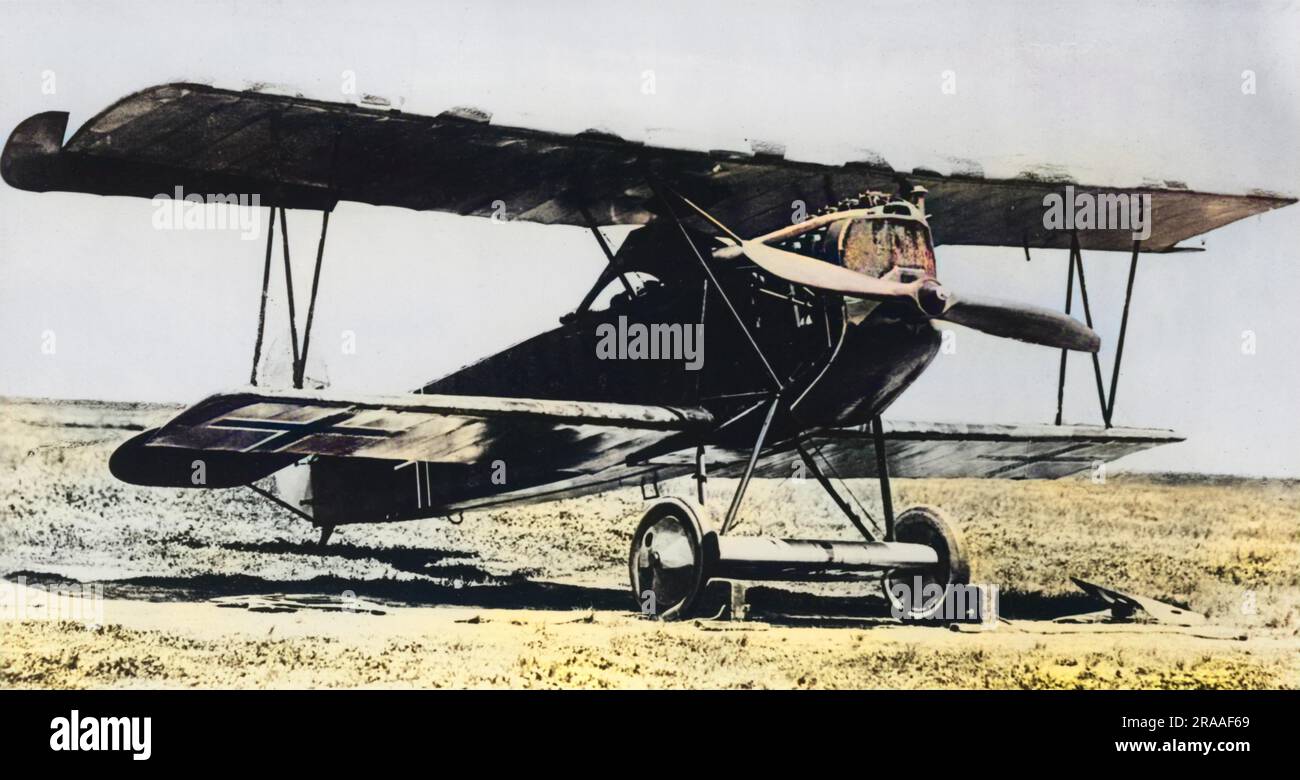 A German Fokker D VII fighter plane on an airfield towards the end of the First World War. It had a 180 hp Mercedes engine, and was a single-seat fighter plane.  Damage by machine gun bullets can be seen on the radiator.     Date: circa 1918 Stock Photo
