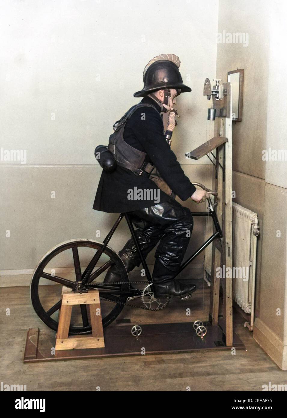 fireman-undergoing-an-ergometer-test-whilst-wearing-full-gear-including-breathing-apparatus-at-lambeth-headquarters-date-1950s-2RAAF75.jpg