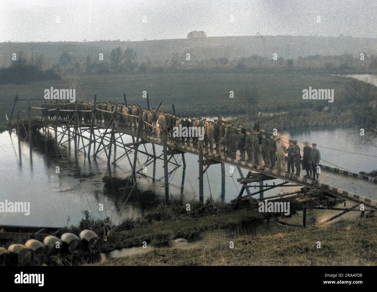 A large number of soldiers standing on a bridge across the river at Tidworth, Wiltshire.     Date: Dec-15 Stock Photo