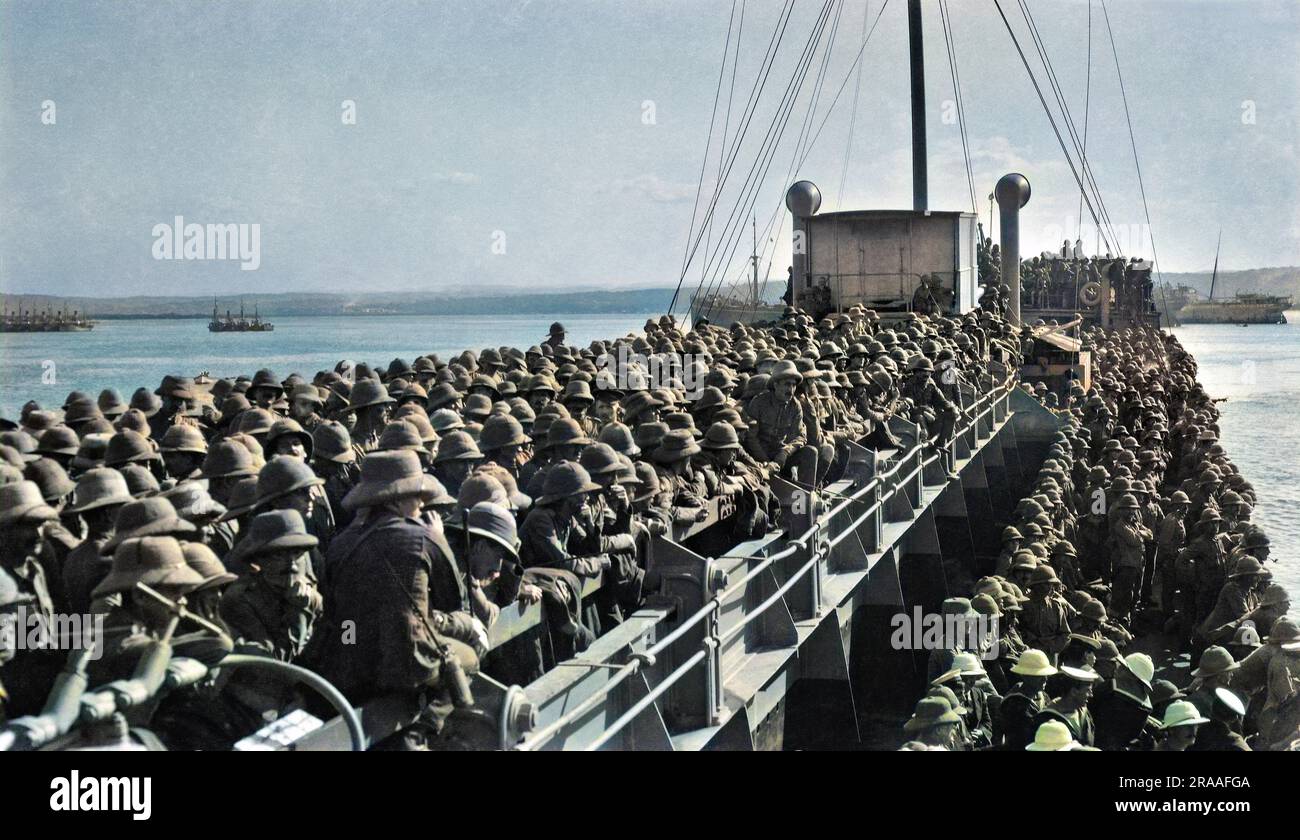 A large number of military men in pith helmets on board ship. Stock Photo