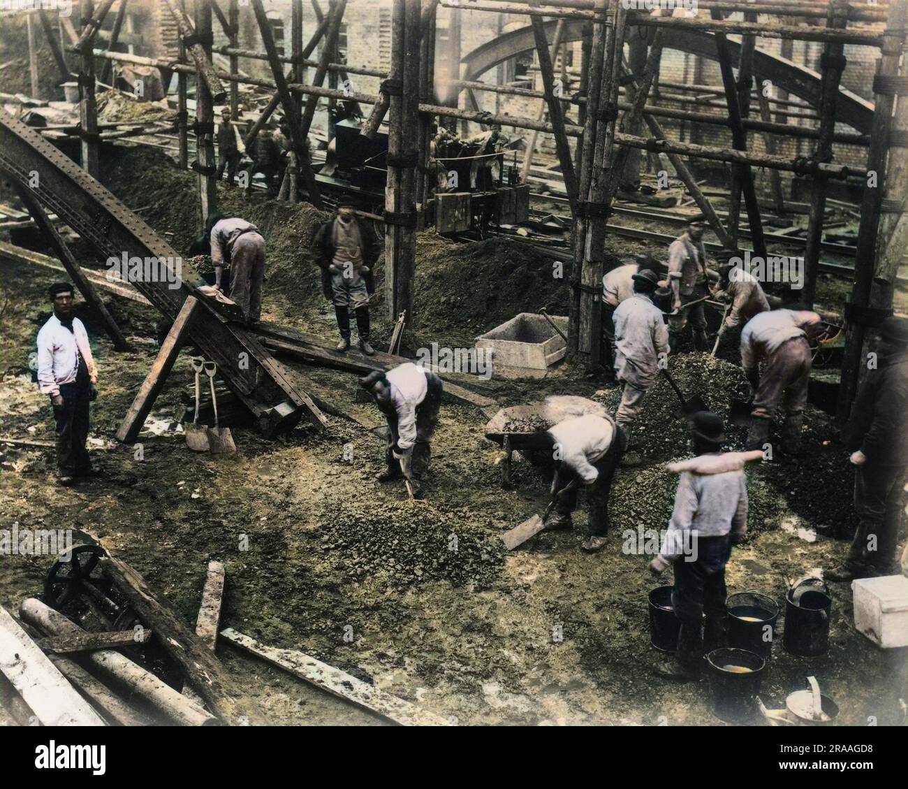 A group of navvies working on an elevated section of an inner London railway.     Date: 19th century Stock Photo