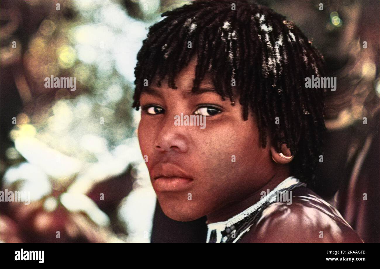 A close-up photograph of a Zulu girl with short dreadlocked hair.     Date: 1936 Stock Photo