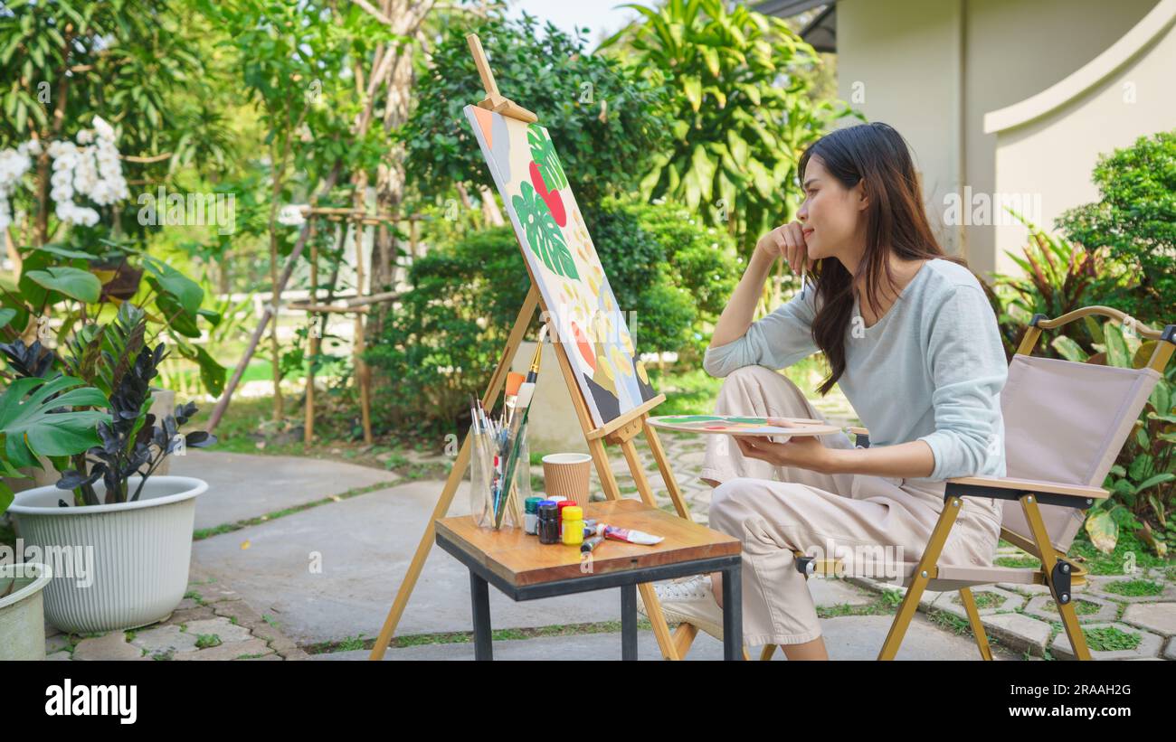 Outdoor activity concept, Female artist thoughtful and looking on ...