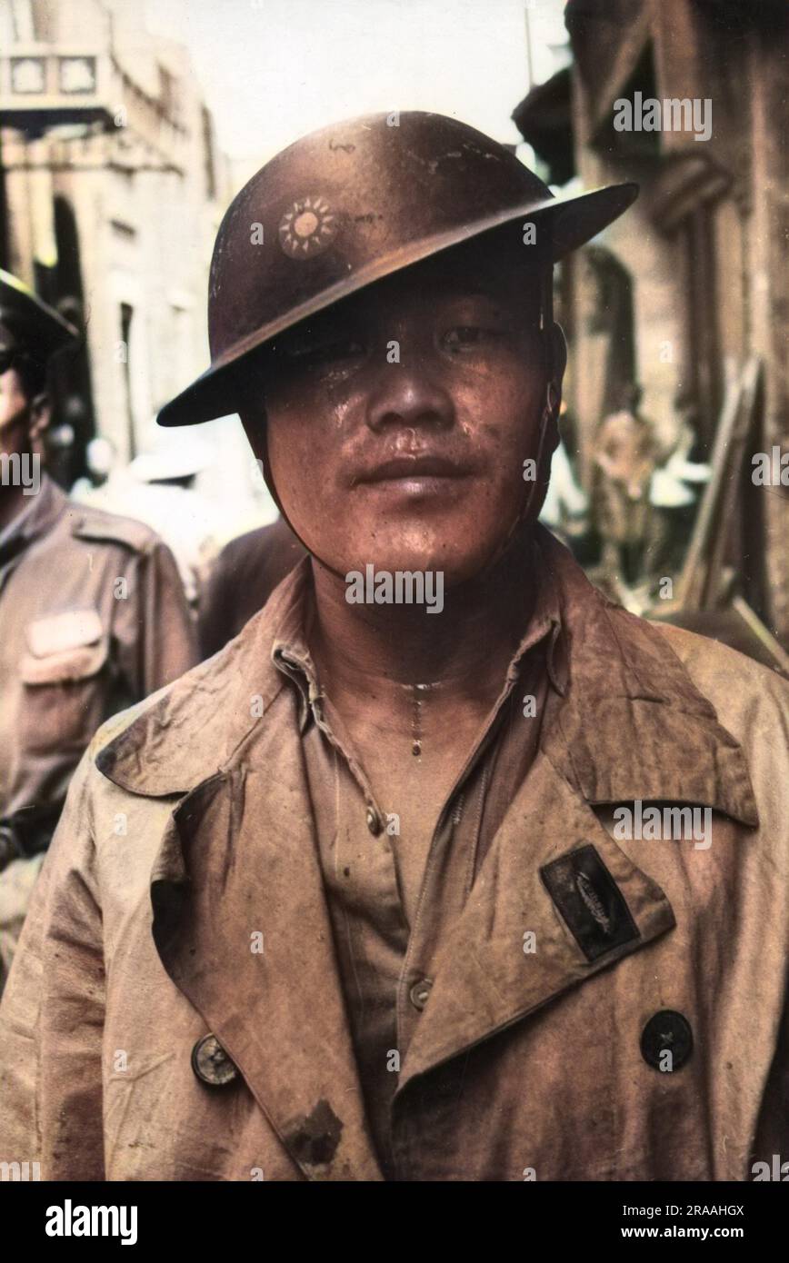 A policeman in the slum district of one of the three Wuhan cities in China - Hankou (Hankow), Hanyang and Wuchang. Japanese bombing left the homes of many of the poorest Chinese residents destroyed     Date: Jul-38 Stock Photo