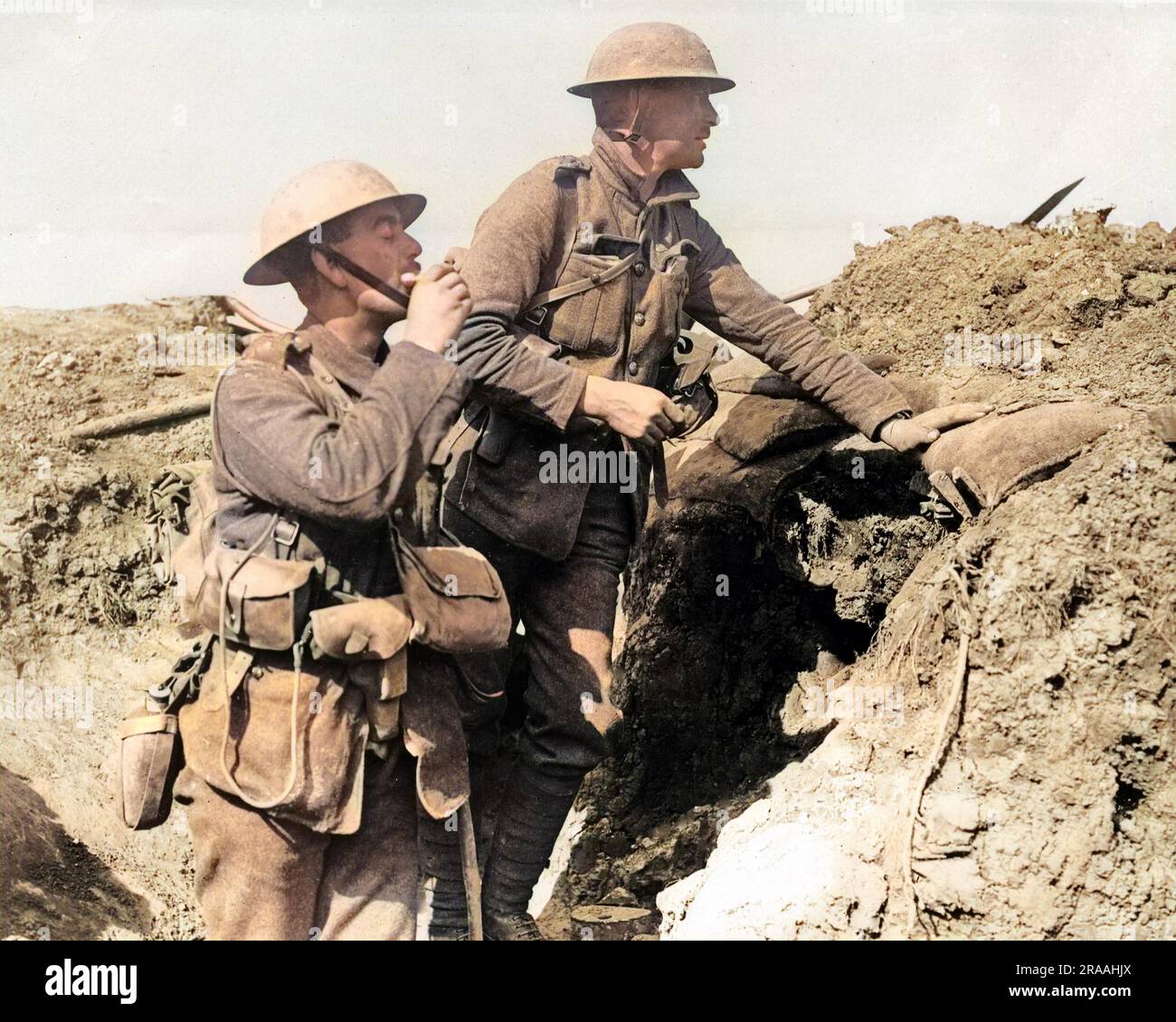 Two British soldiers in a trench on the Western Front during World War One, waiting for the signal to attack.     Date: circa 1916 Stock Photo