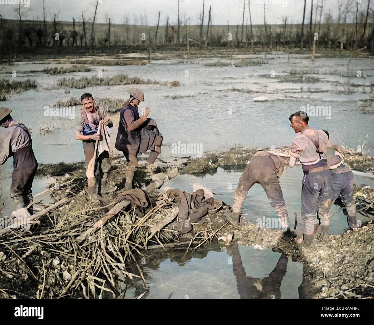British soldiers washing and cleaning up in a swamp on the Somme, Western Front, during World War One.     Date: circa 1916 Stock Photo