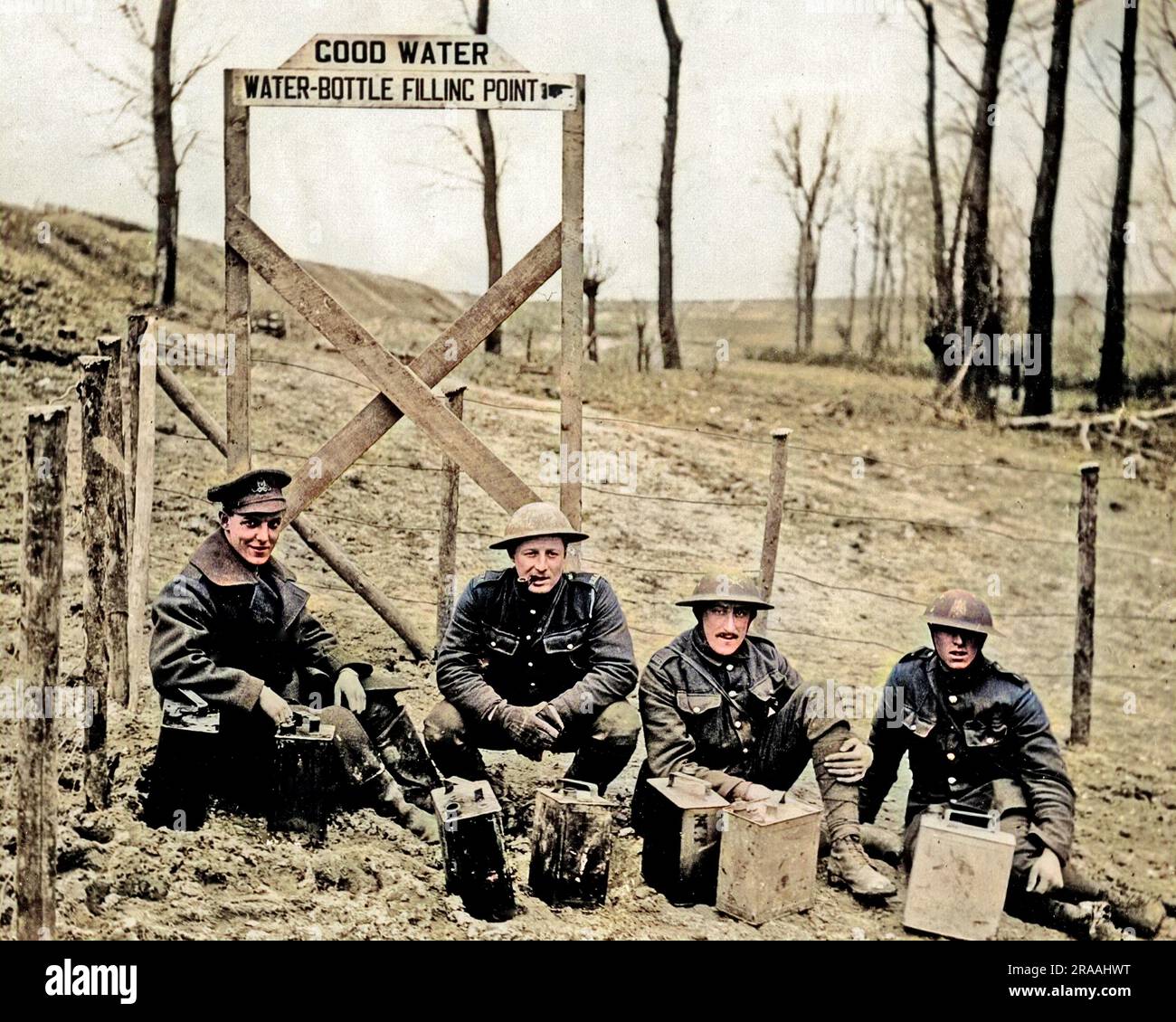 Four British soldiers with cans of water near a supply point on the Western Front during World War One.     Date: circa 1916 Stock Photo