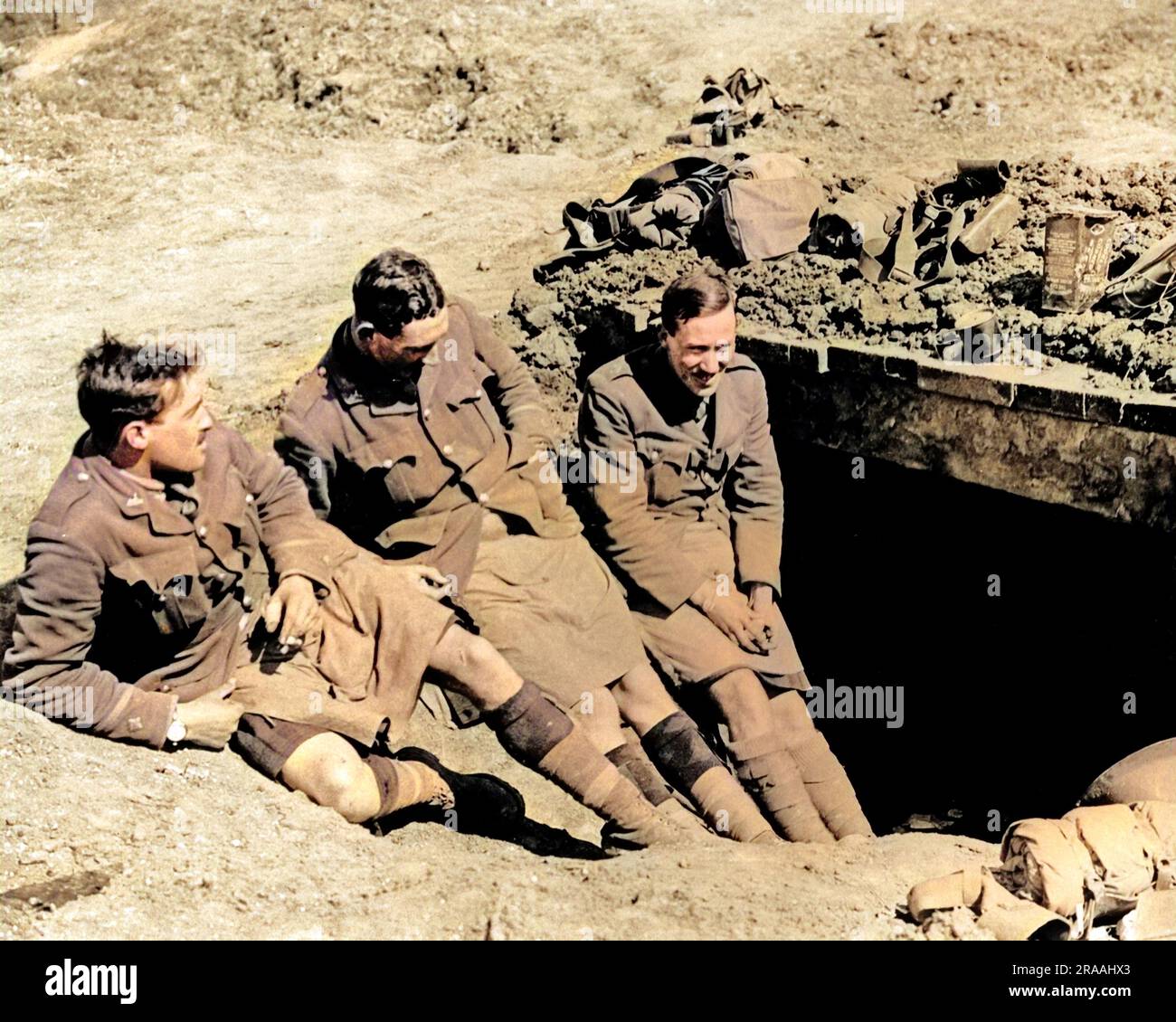Gordon Highlanders relaxing outside their dugout on the Western Front during World War One.     Date: circa 1916 Stock Photo