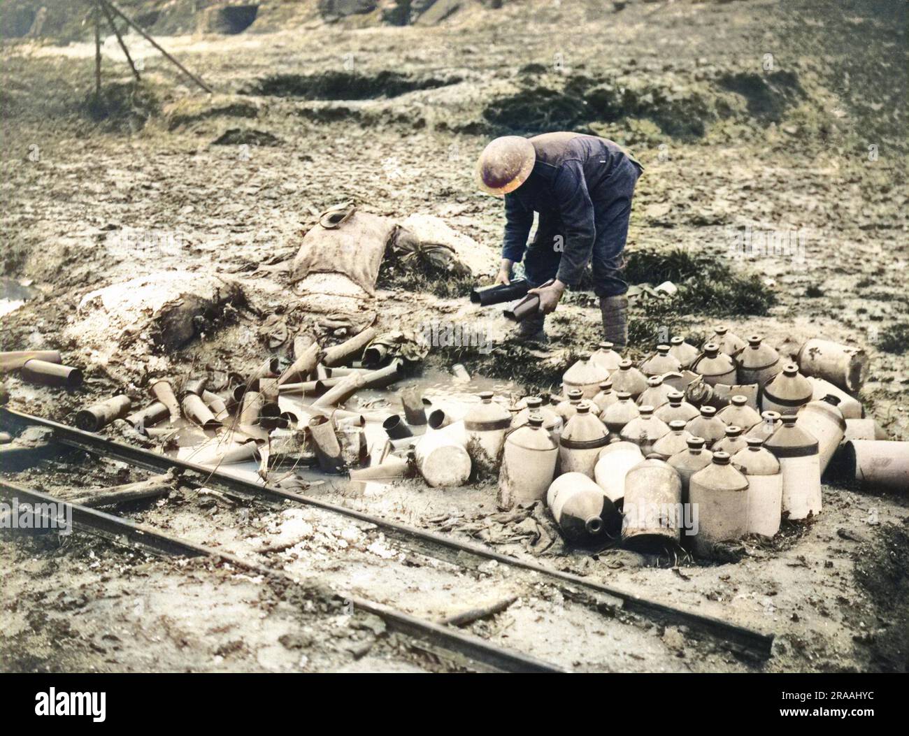 A British soldier cleaning up debris on the Western Front during World War One.     Date: circa 1916 Stock Photo