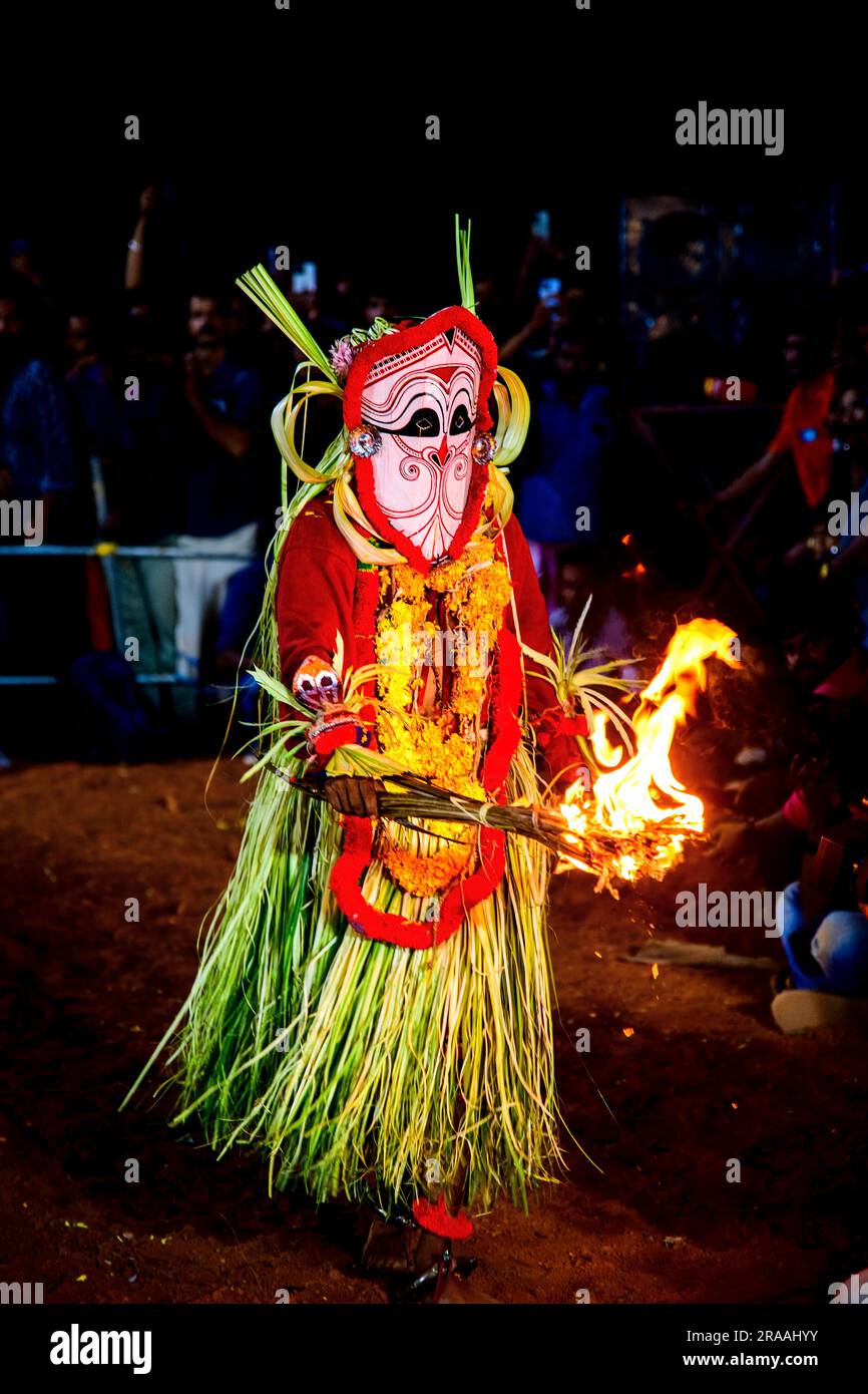 Capturing the Mystical Splendor of Theyyam: Vibrant Images of Kerala's Sacred Rituals Stock Photo