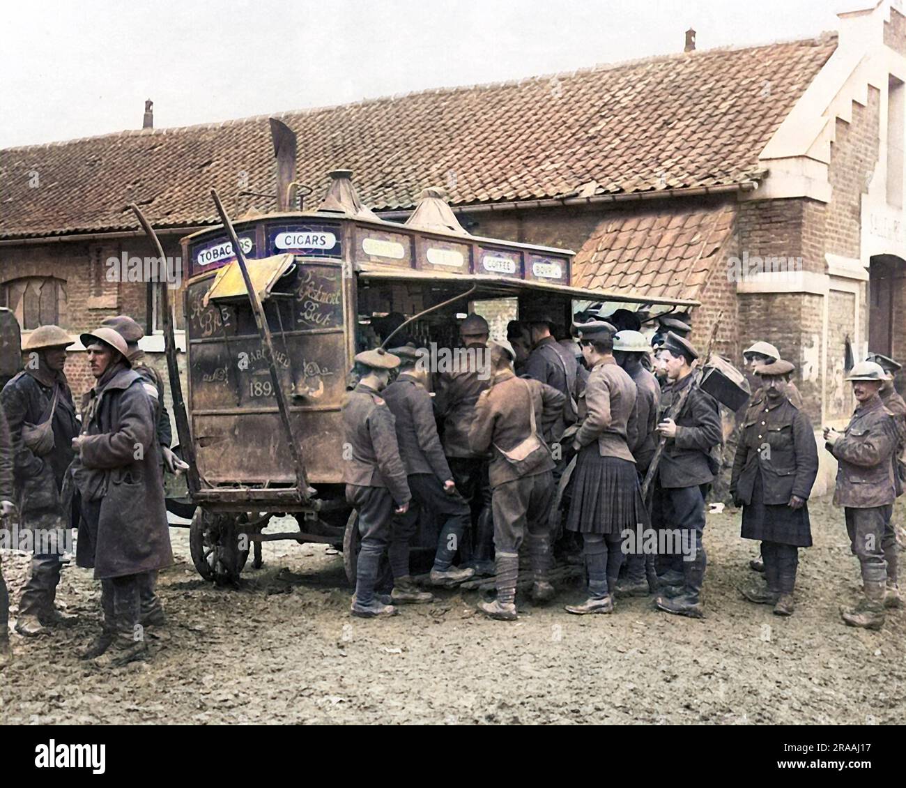 A coffee stall brought from London to the Western Front in France during World War One, with soldiers gathered round it.     Date: circa 1916 Stock Photo