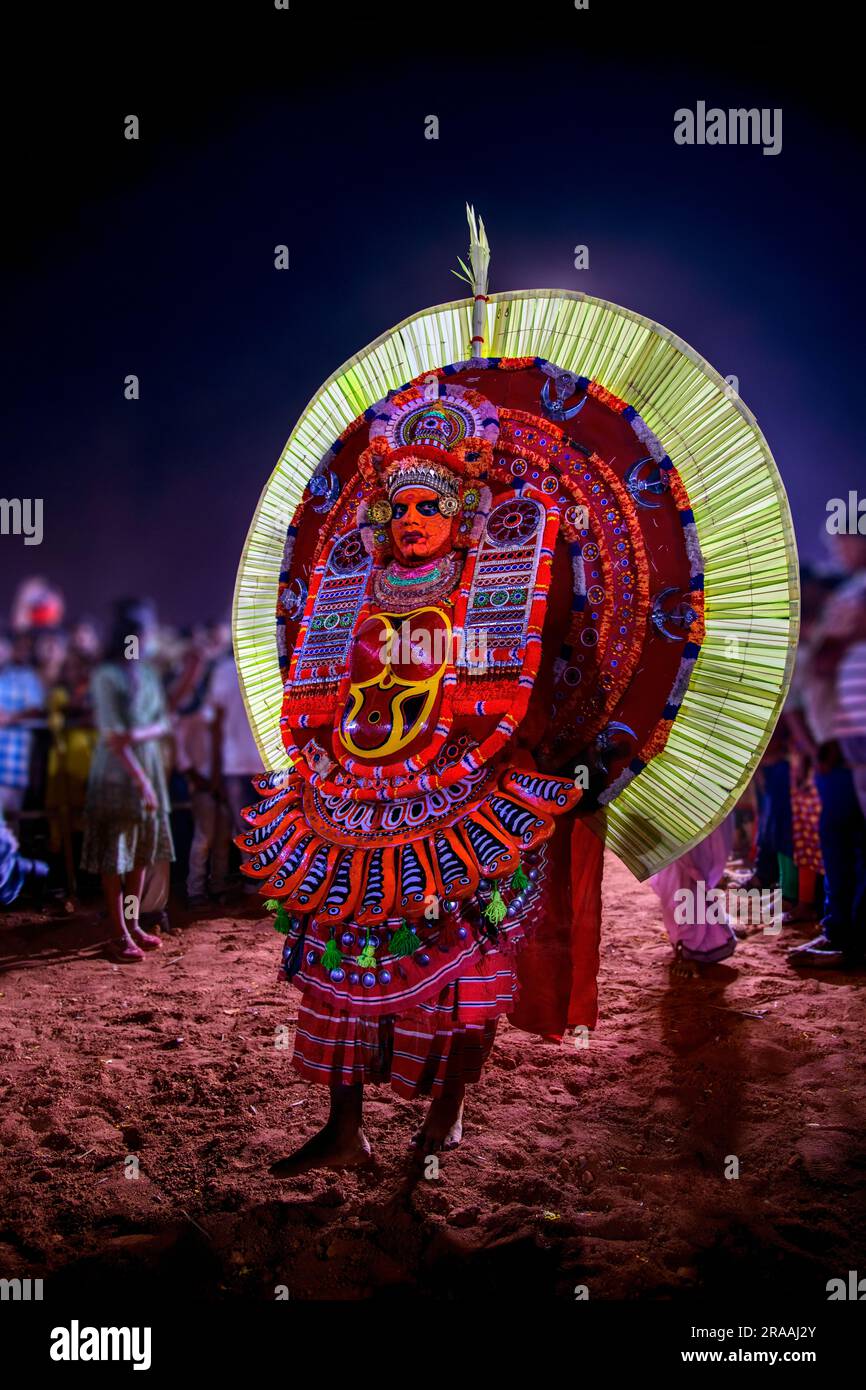 Capturing the Mystical Splendor of Theyyam: Vibrant Images of Kerala's Sacred Rituals Stock Photo