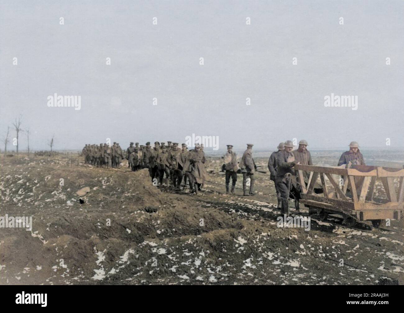 British troops walking along a light railway on the Western Front in France during World War One.     Date: circa 1916 Stock Photo