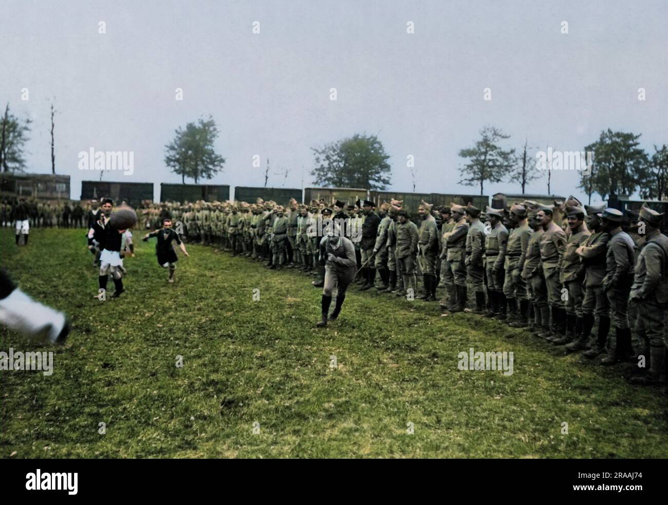 British and French soldiers playing and watching football on the Western Front in France during World War One.     Date: circa 1916 Stock Photo