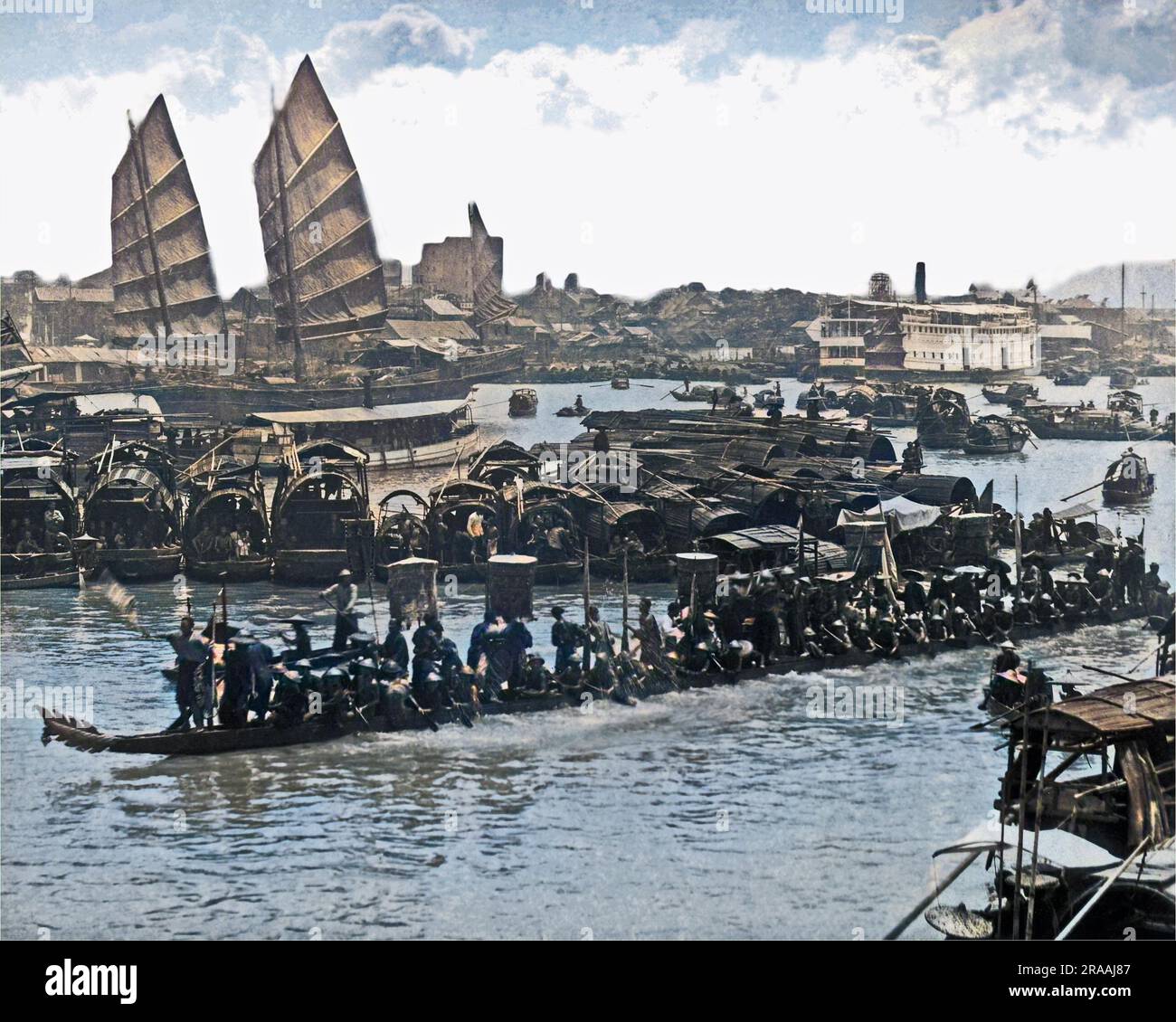 Dragon boat on the water, China.     Date: circa 1890 Stock Photo