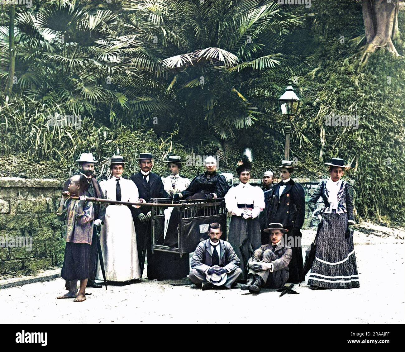 A group of Western people, surrounding a woman in a carrying chair, Hong Kong, China.     Date: circa 1890 Stock Photo