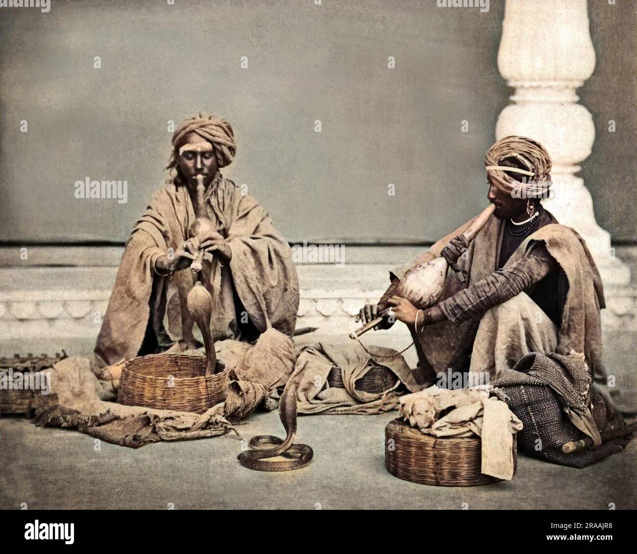 Two snake charmers, India.     Date: circa 1890s Stock Photo