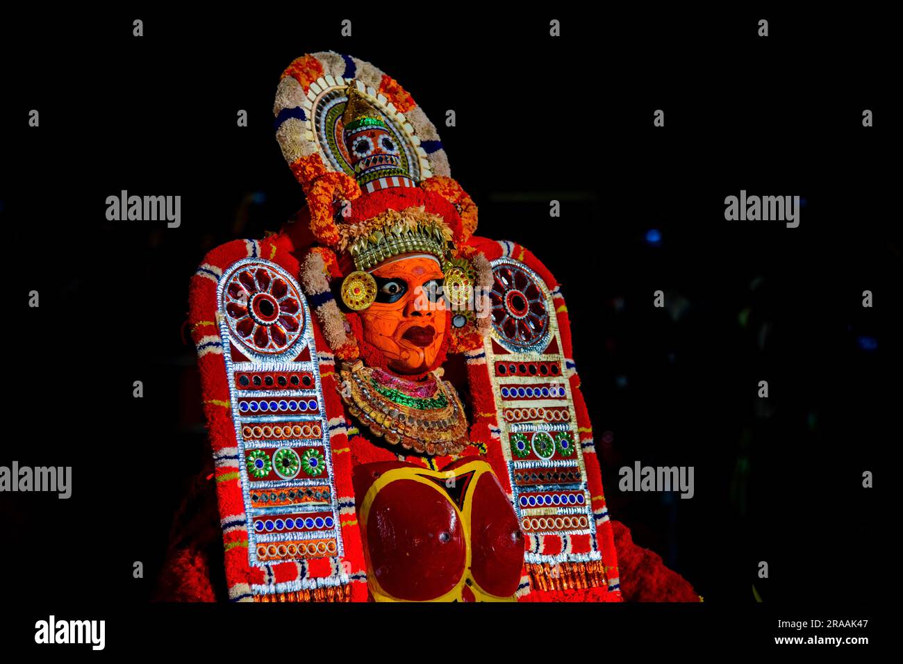 Capturing the Mystical Splendor of Theyyam: Vibrant Images of Kerala's Sacred Rituals Stock Photo