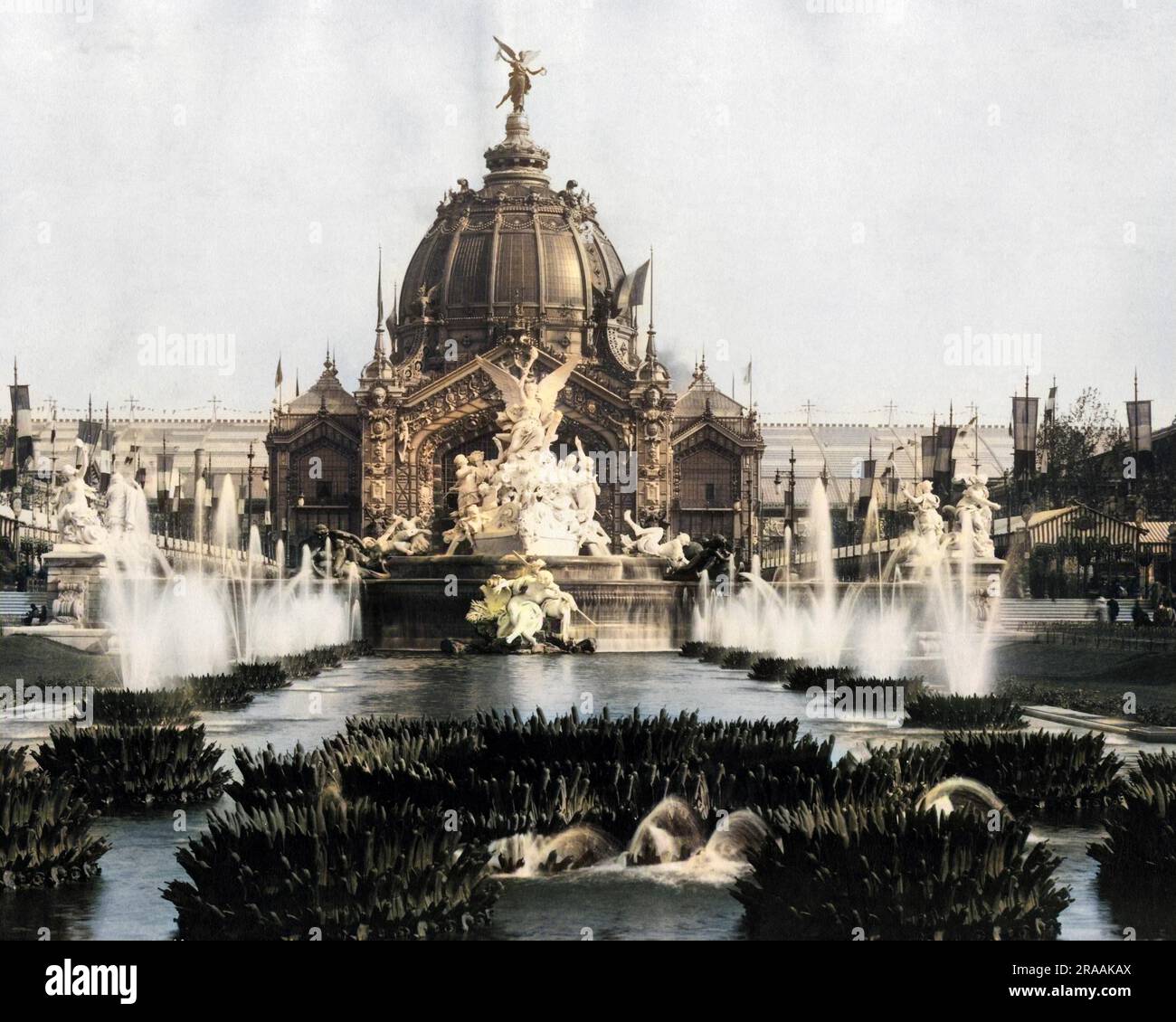 Scene during the Universal Exhibition (Exposition Universelle), Paris, France, with a large fountain and a domed building.     Date: 1900 Stock Photo