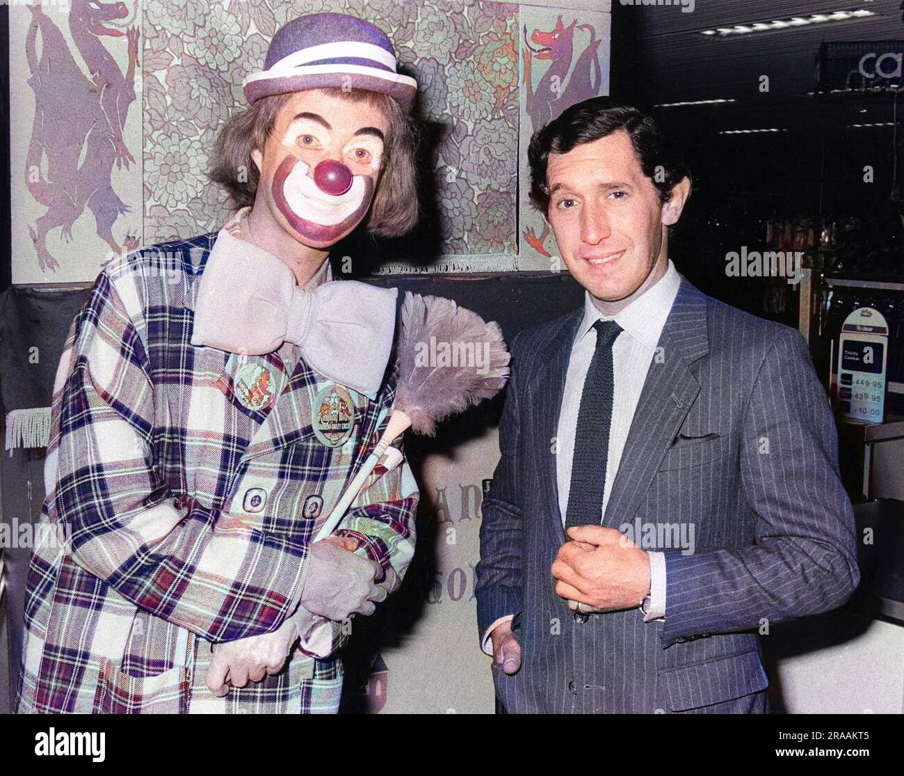 Peter Hugo (Prince Charles lookalike) with a clown. Date: circa 1980s ...