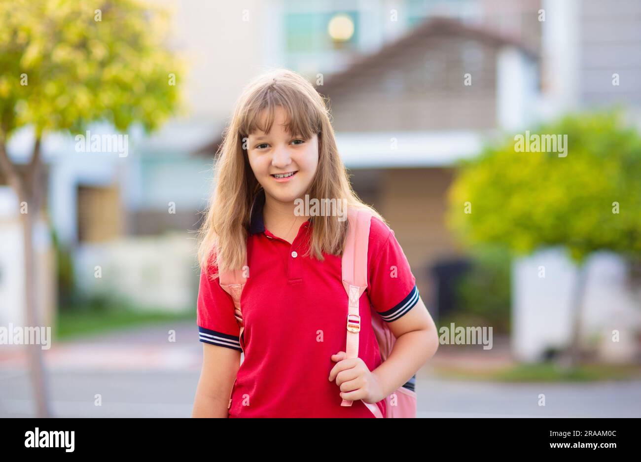Children go back to school. Start of new school year after summer vacation. Girl with backpack