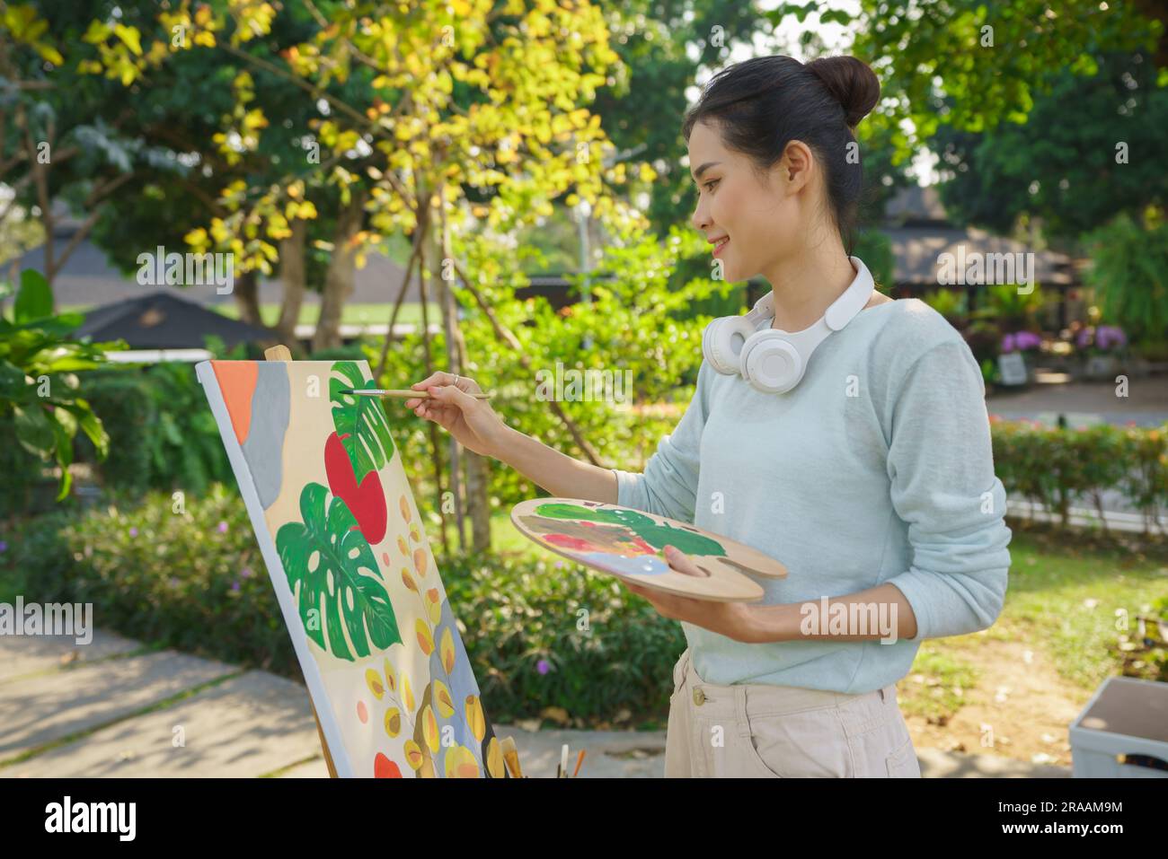 Creative art concept, Female artist holding color palette and painting ...