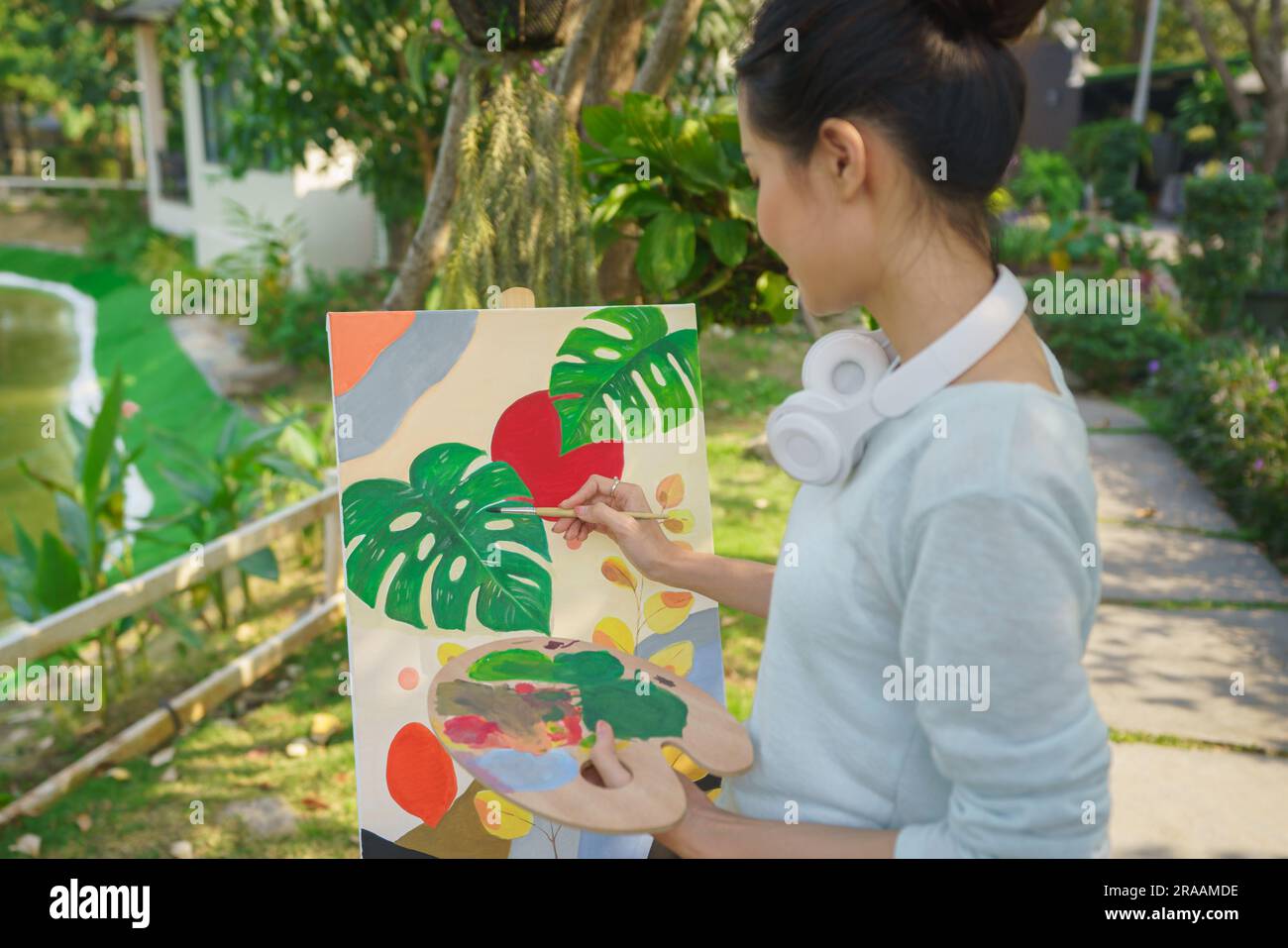 Artist concept, Female artist holding color palette and painting ...