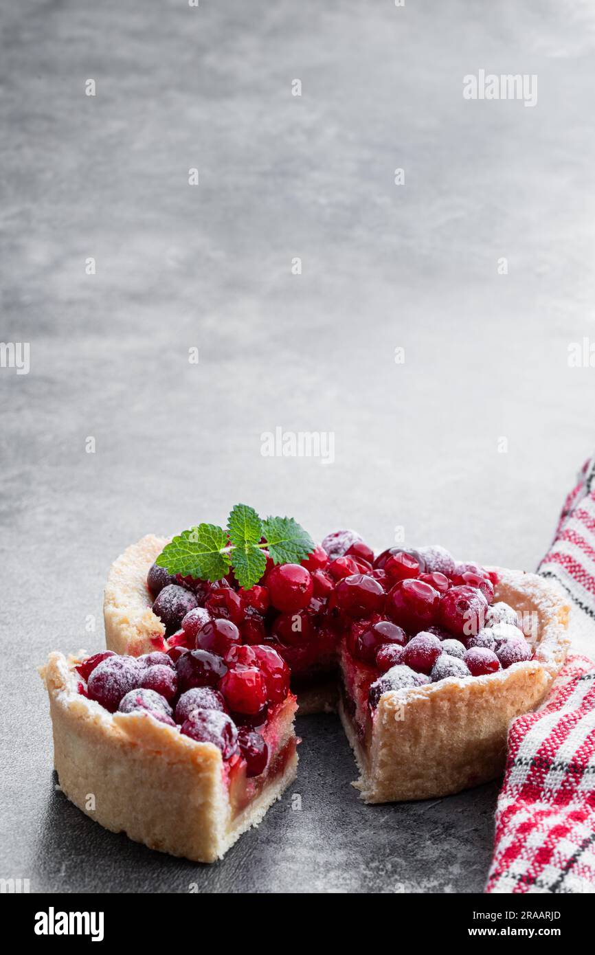Tasty  homemade cranberry pie on gray background Stock Photo