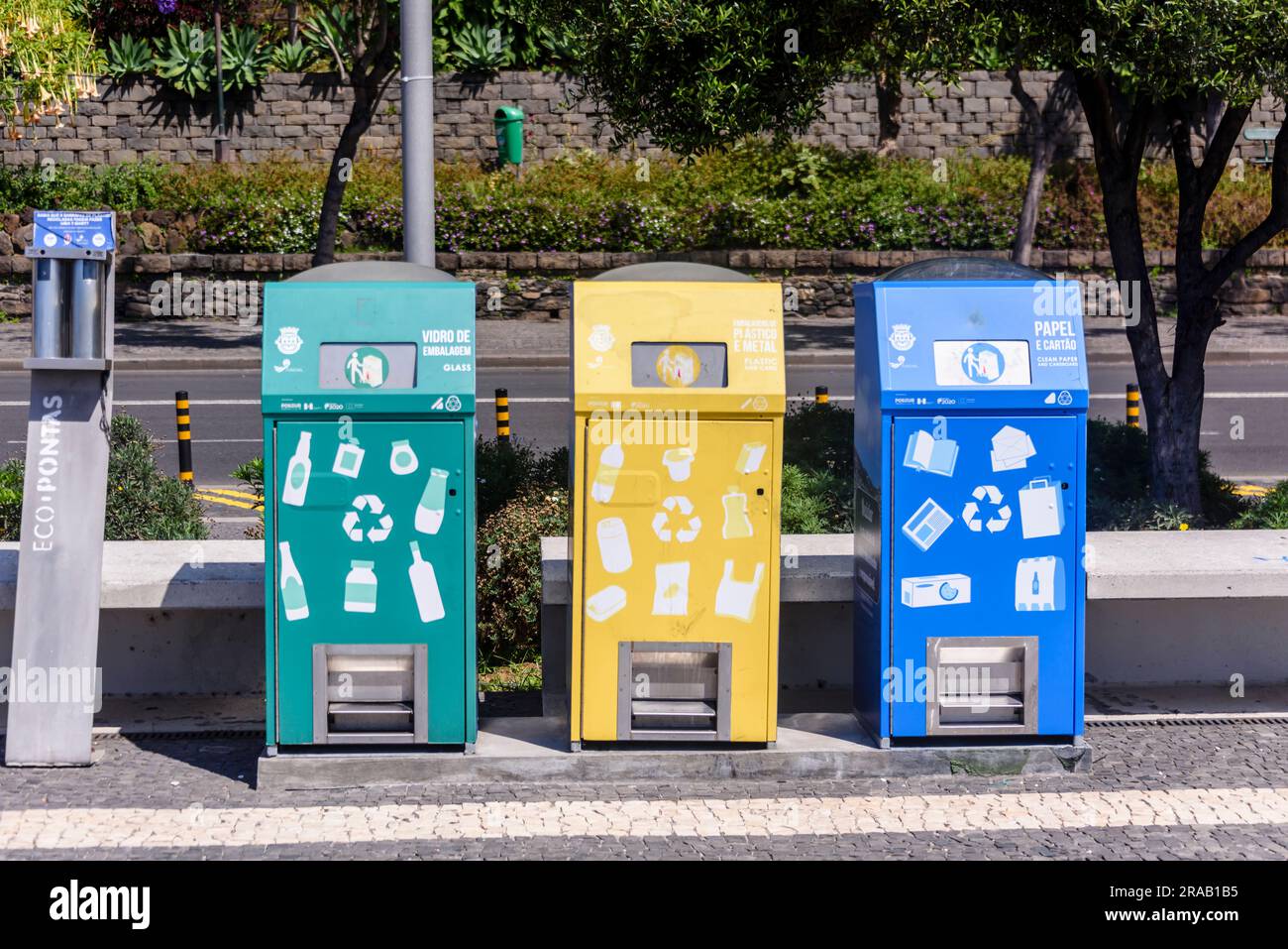 Green, yellow and blue recycling bins, Portugal Stock Photo