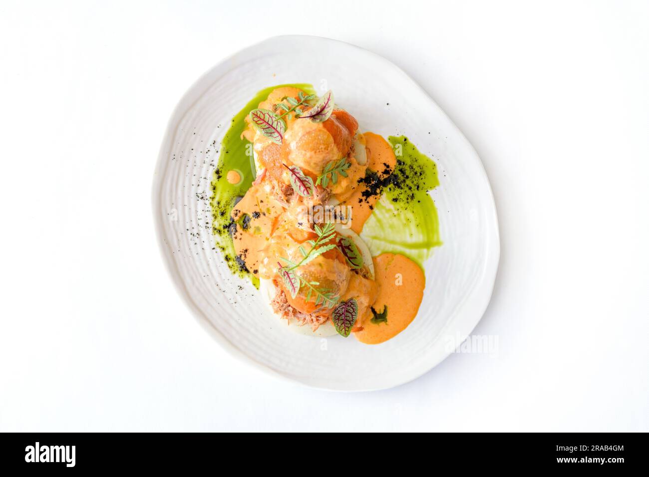 Bao with pulled beef, pumpkin sauce and arugula Stock Photo