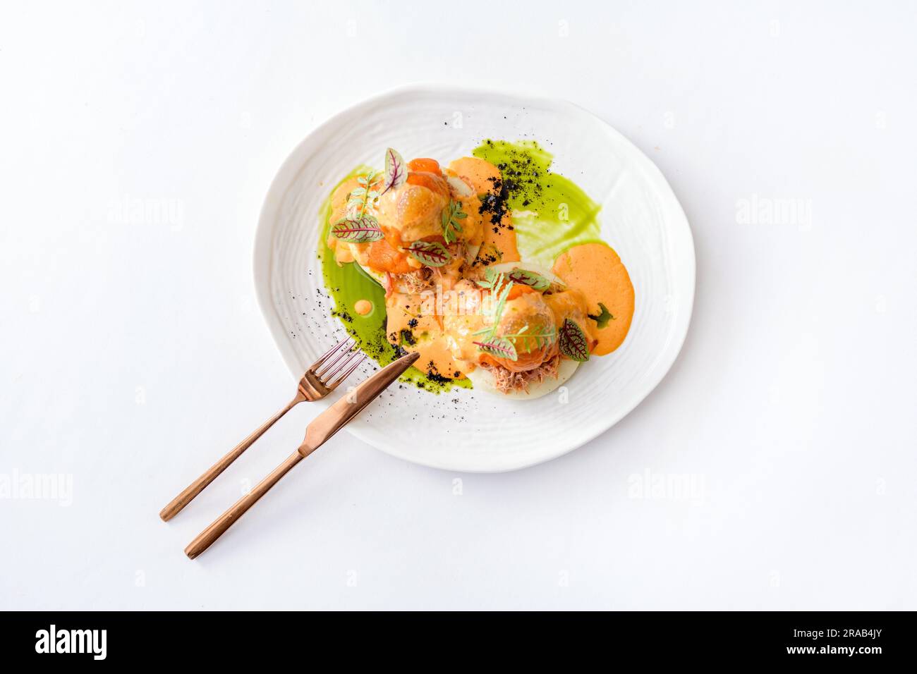 Bao with pulled beef, pumpkin sauce and arugula Stock Photo