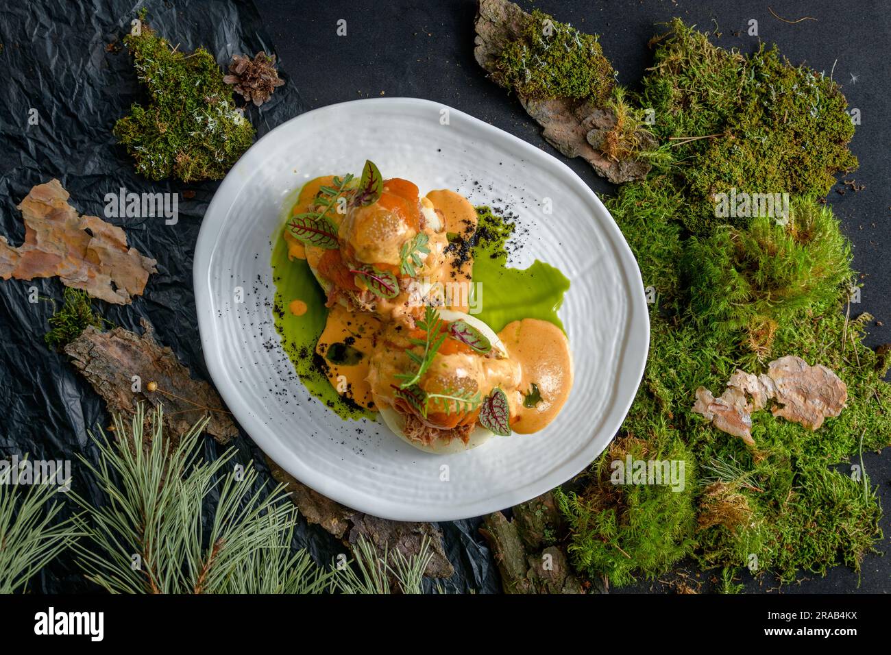 Bao with pulled beef, pumpkin sauce and arugula Stock Photo