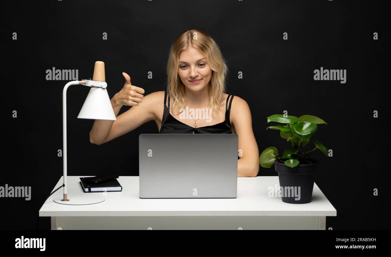 Young happy fun secretary employee business blonde woman showing thumb ...