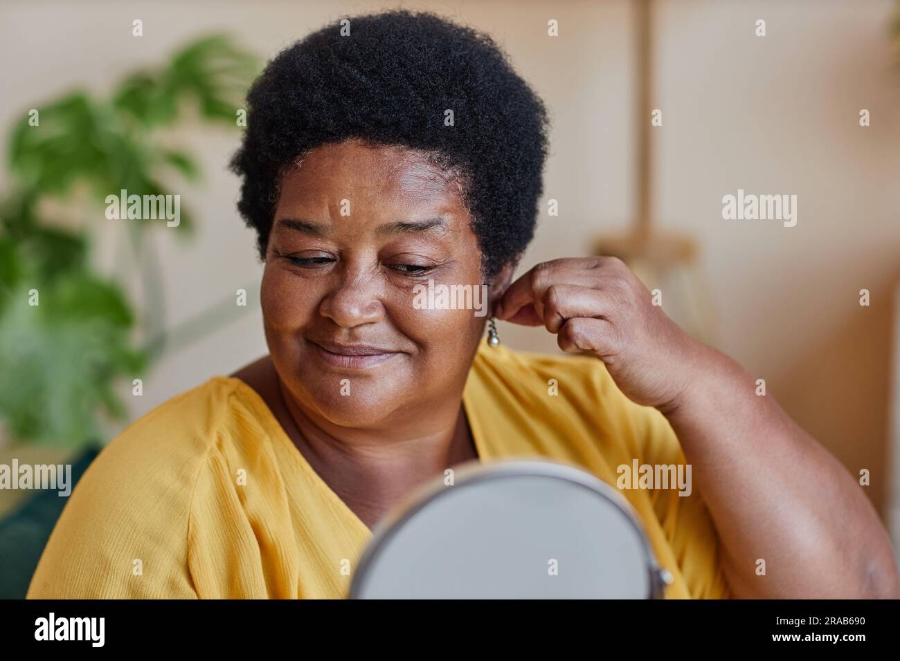 Mature woman trying on pearl hi-res stock photography and images - Alamy