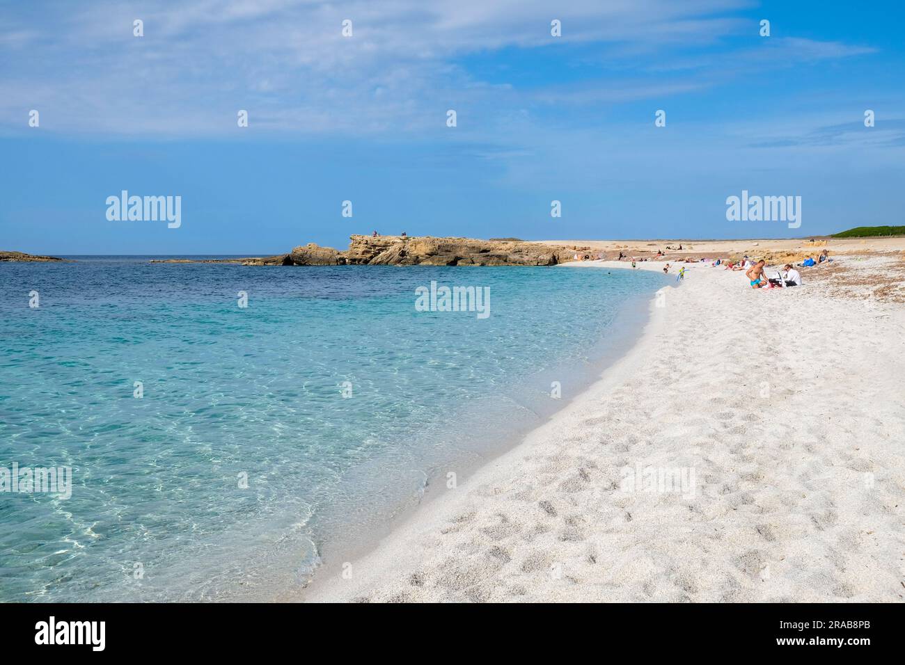 Clear blue water and beautiful sand of Is Arutas beach on the west coast of Sardinia, Cabras, Oristano, Sardinia. Stock Photo