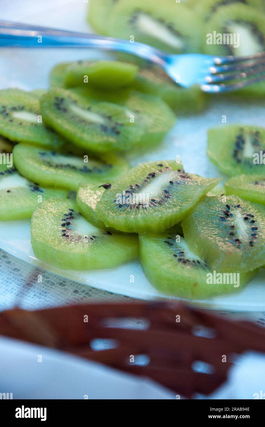 Sliced kiwi to decorate breakfast table Stock Photo