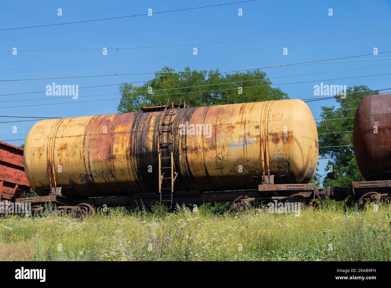 old tank for oil transportation stands on the railway